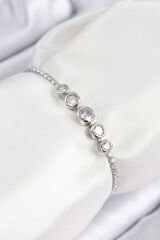 Pirinç Zirkon Taşlı Sıralı Daire Model Gümüş Renk Asansörlü Kadın Bileklik